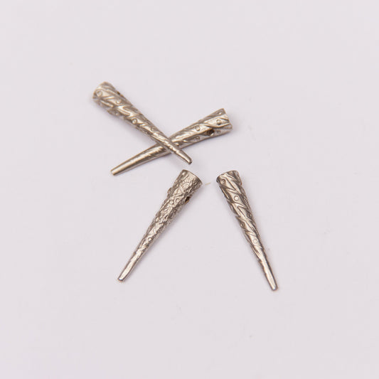 Small embossed aglet