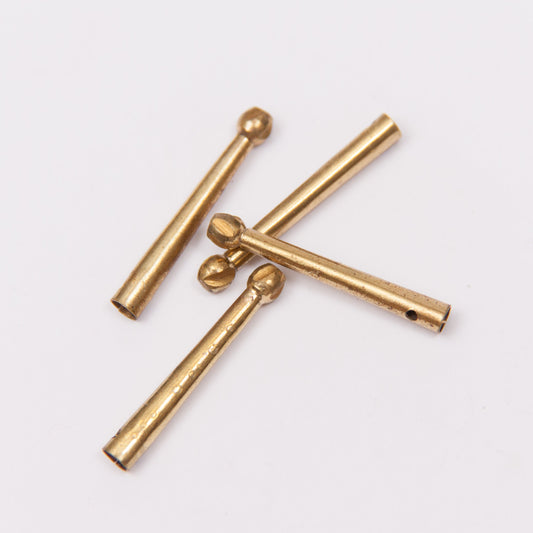 Aglet with pommel top